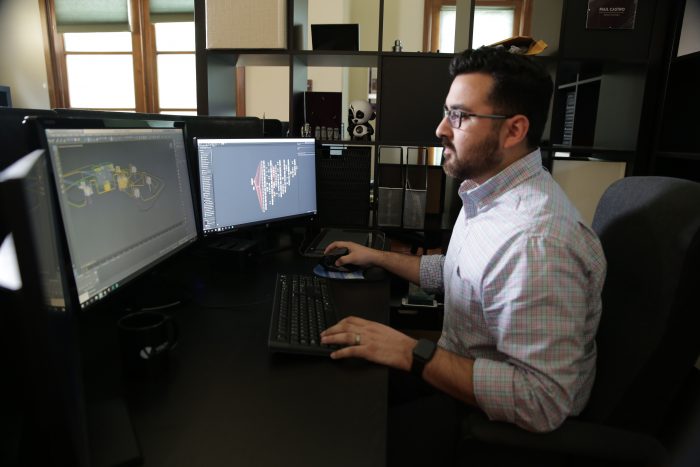 3D animator working at computer